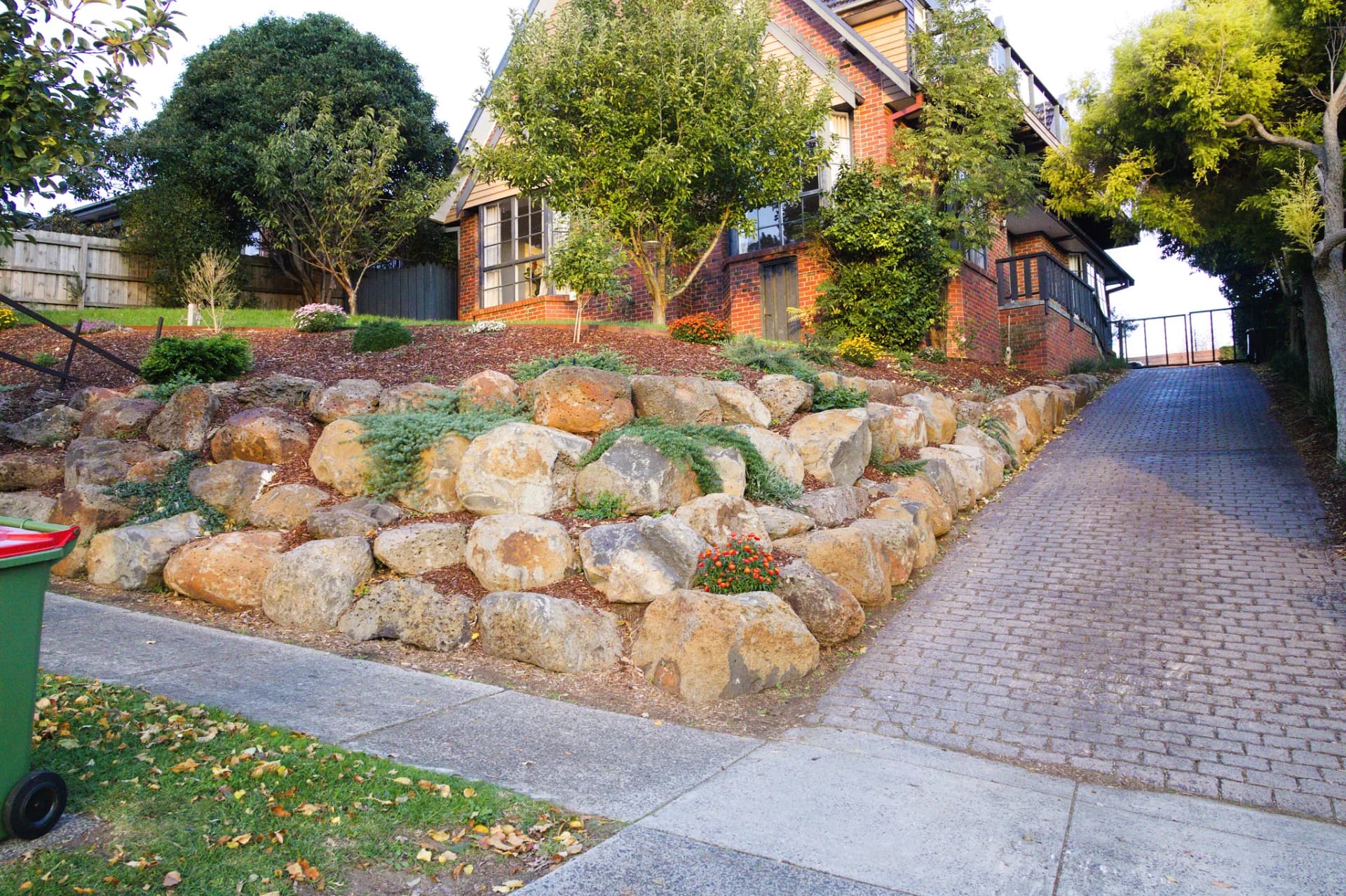 Tiered boulder retaining wall built by Rock'n Earthworks